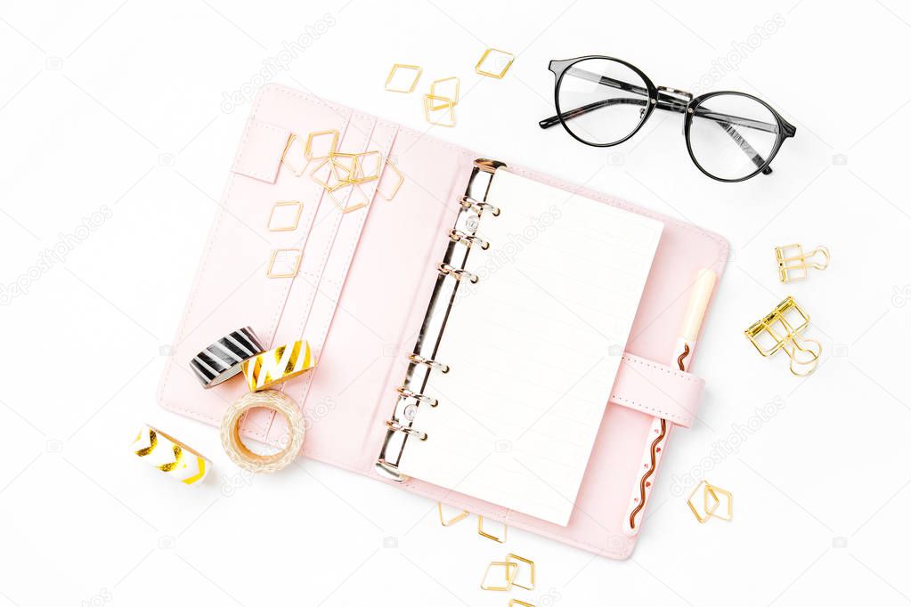 Pink planner with Business Stationery concept. Flat lay, top view