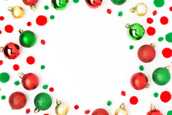 green and red christmas baubles isolated on white background