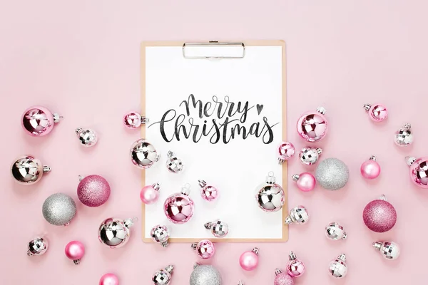 Merry Christmas Card Clipboard Surrounded Festive Decorations Pink Background — Stock Photo, Image