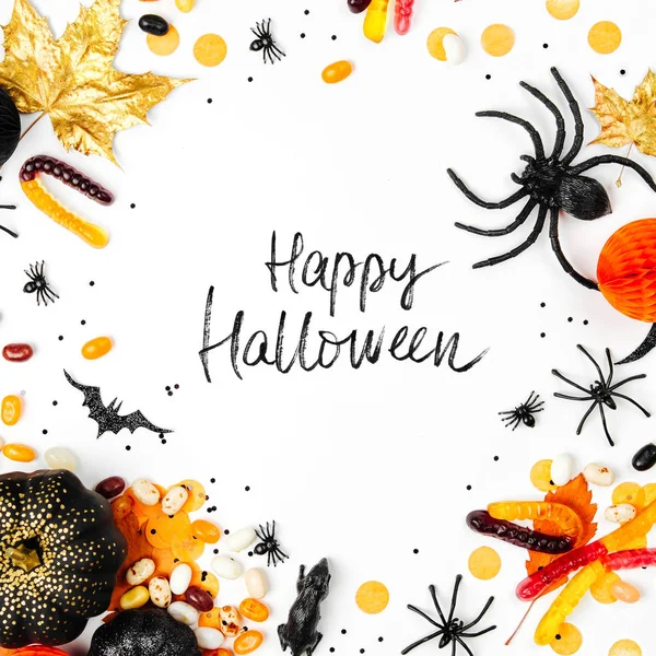 holiday poster with candies, decorations and happy halloween lettering