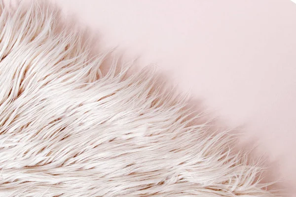 Pink fluffy fur plaid on pink background