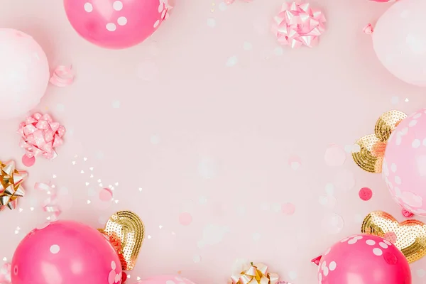 festive frame of pink balloons and decorations