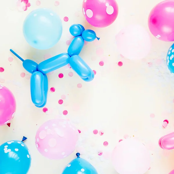 Colorful balloons on pastel colored background