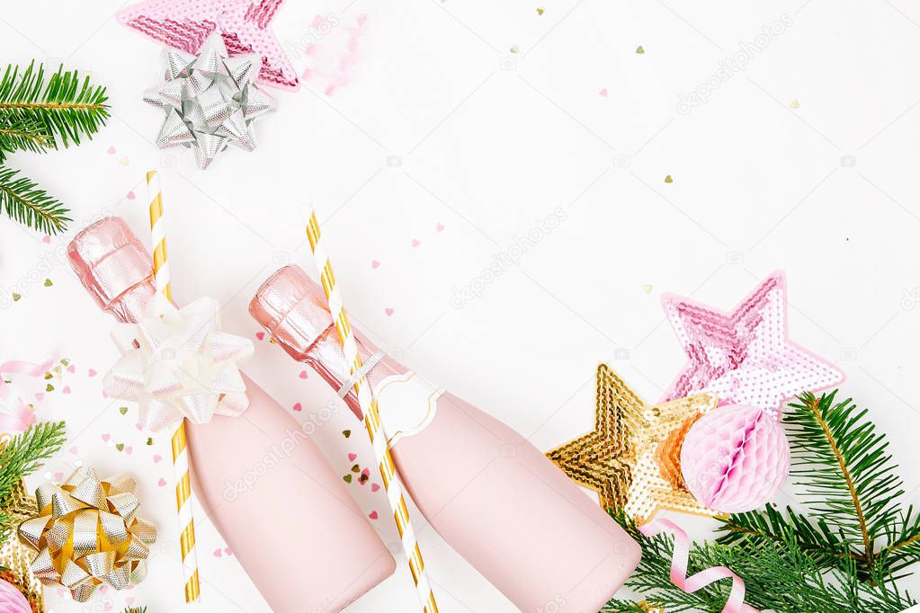 fir branches, pink champagne bottles and decorations