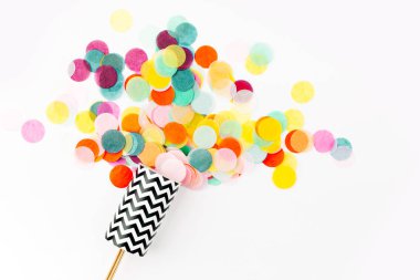Confetti shots out on white background clipart