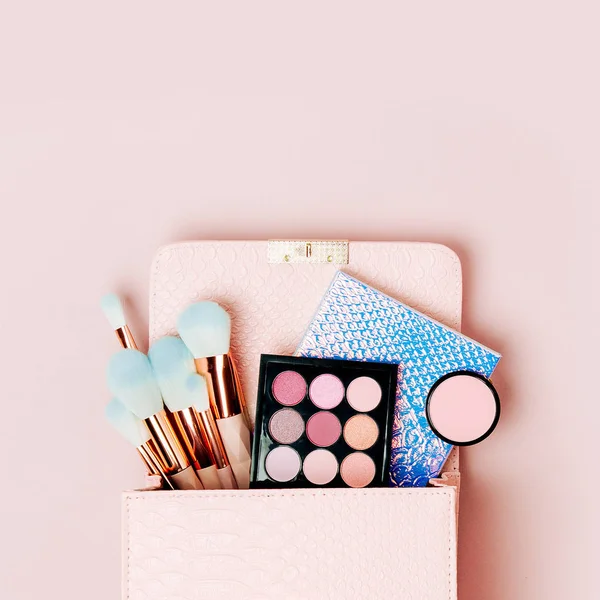 Makeup bag with cosmetic beauty products. Flat lay, top view. Beauty and Fashion concept