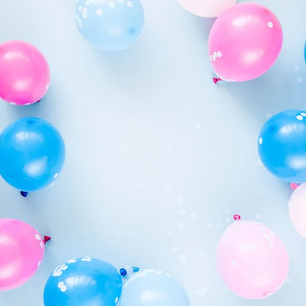 Colorful balloons on pastel color background. Festive or birthday party concept. Flat lay, top view.