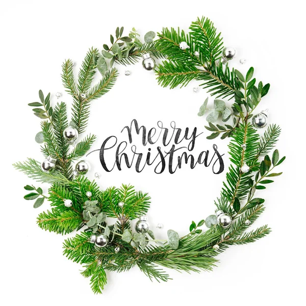 Beautiful round frame of  fir and pine branches with Christmas decorations white background. Christmas concept. Flat lay, top view