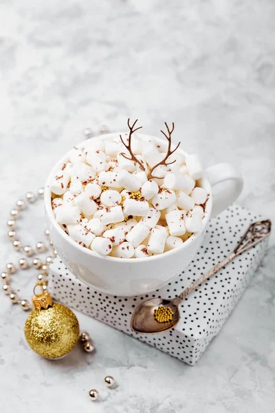 Coffee cup with marshmallow and cute deer antlers. Christmas concept