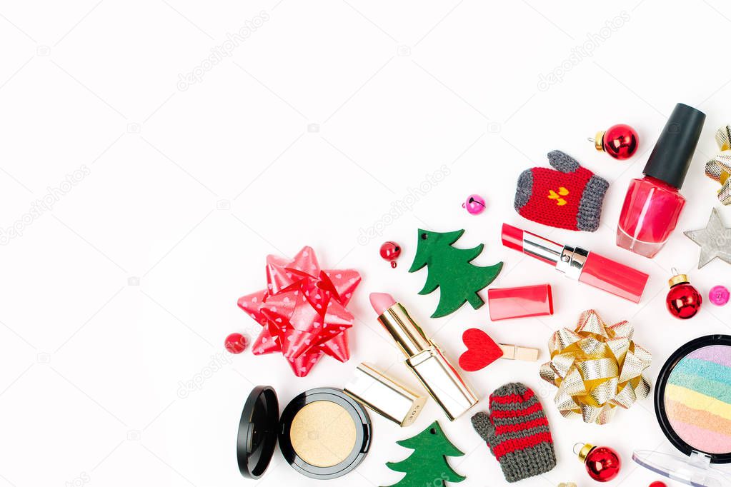 Christmas  decorations and cosmetic products on white background. Holiday and celebration creative concept. Flat lay, top view