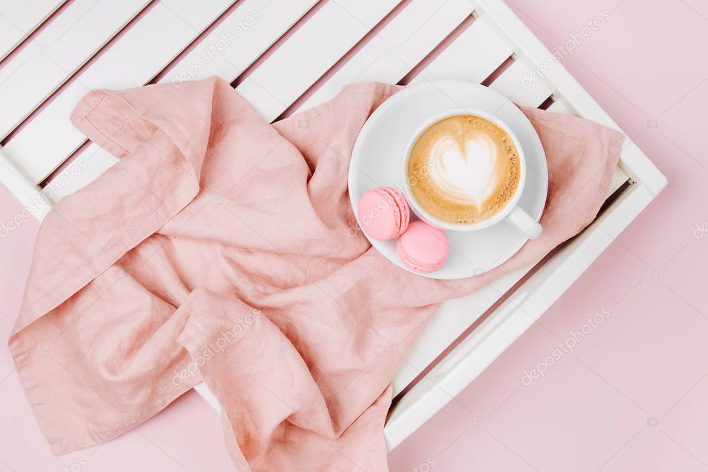 Cup of coffee on white wooden serving tray. Flat lay, top vie