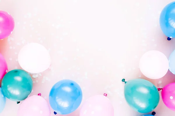 Colorful balloons on pastel color background, festive or birthday party concept