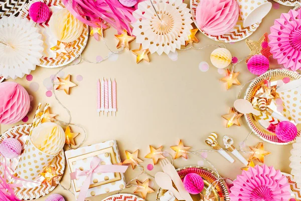 Birthday party background. Gold and pink color. Flat lay, top view