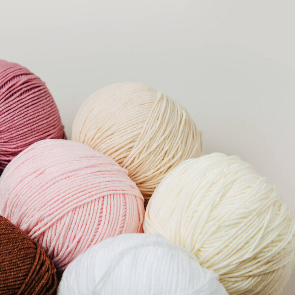 Colorful yarn for knitting on White background. 