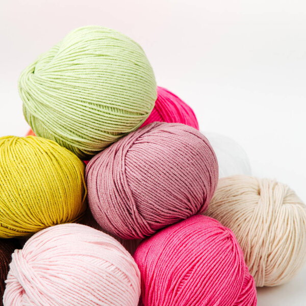 Colorful yarn for knitting on White background. 