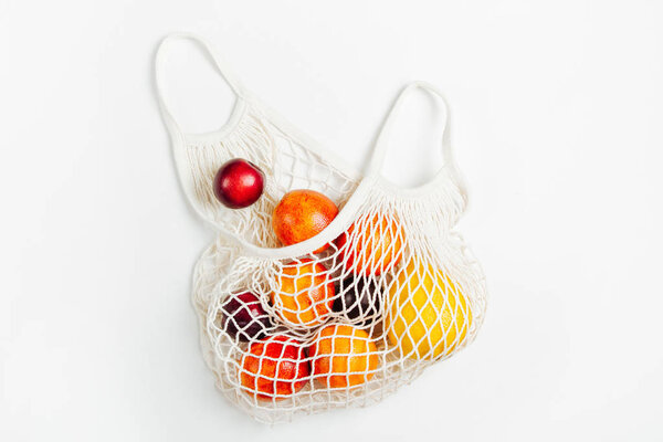 Cotton net bag with fruits. Sustainable lifestyle.  Eco friendly concept.