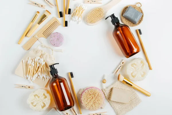 Set of Eco cosmetics products and tools. Soap, Shampoo Bottles, bamboo toothbrush, natural wooden brush. Zero waste, Plastic free. Sustainable lifestyle concept.