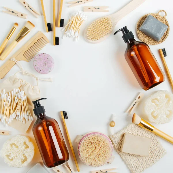 Set of Eco cosmetics products and tools. Soap, Shampoo Bottles, bamboo toothbrush, natural wooden brush. Zero waste, Plastic free. Sustainable lifestyle concept.