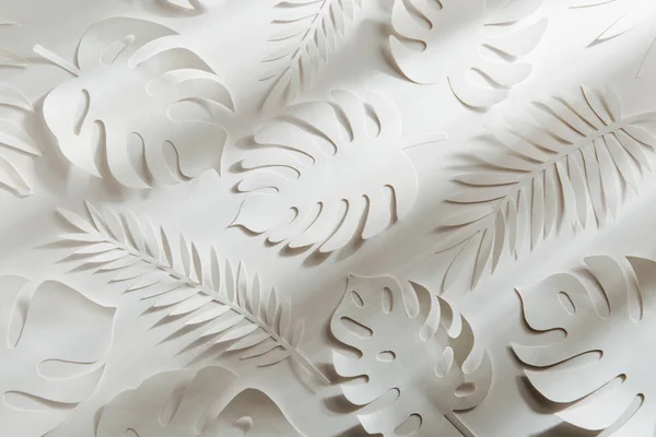Tropical leaves pattern. Various paper leaves on white background. Paper art. Flat lay, top view