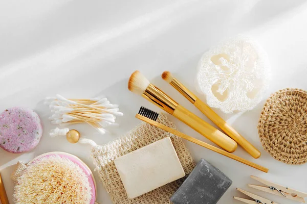 Set of Eco cosmetics products and tools. Soap, Shampoo Bottles, bamboo toothbrush, natural wooden brush. Zero waste, Plastic free. Sustainable lifestyle concept.