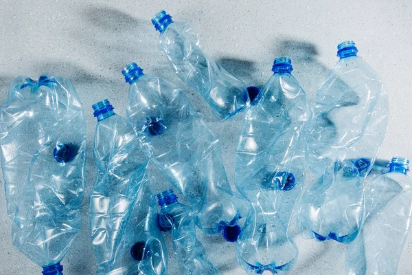 Blue single use plastic bottles, concept of recycling plastic and ecology