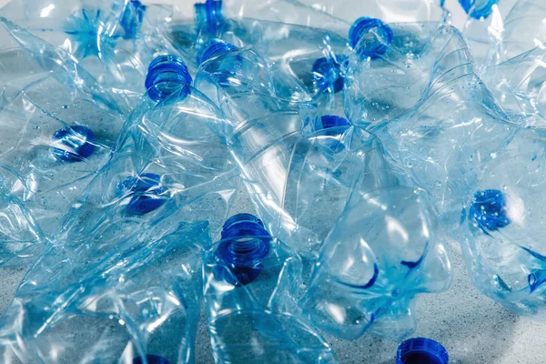 Blue single use plastic bottles, concept of recycling plastic and ecology