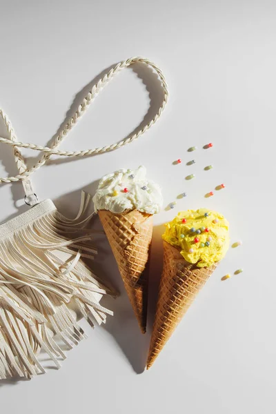 Small white bag with fringe and ice cream