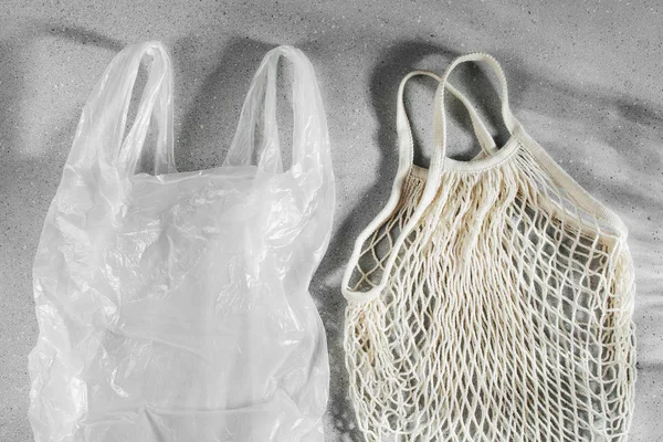 White single use plastic bag and reusable shopping bag