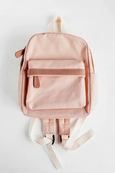 Stylish pale pink backpack on white background