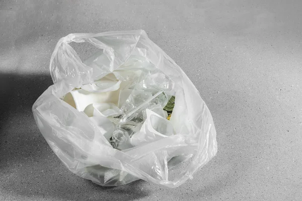 White single use plastic in plastic bag, concept of recycling plastic and ecology