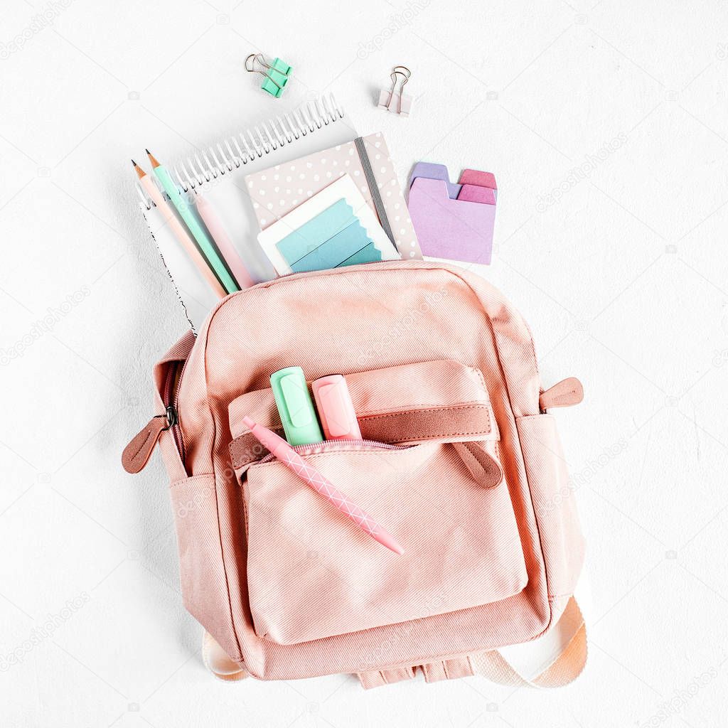 Backpack with school supplies and books for study