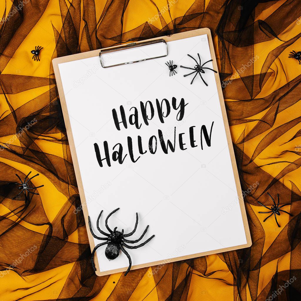 Black and orange abstract background with clipboard, Halloween concept 