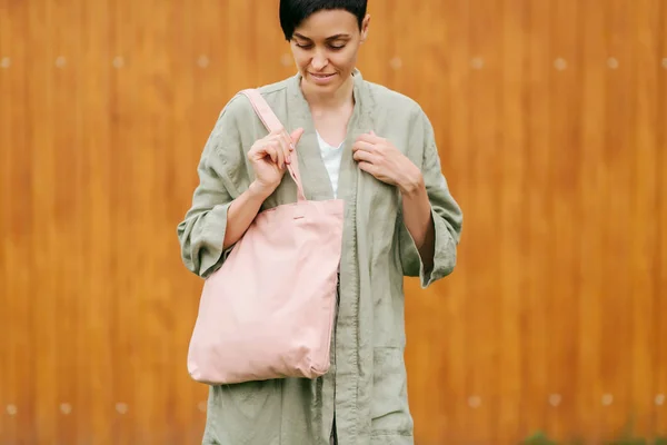 Woman holding canvas tote bag. Reusable eco bag. Eco friendly concept.