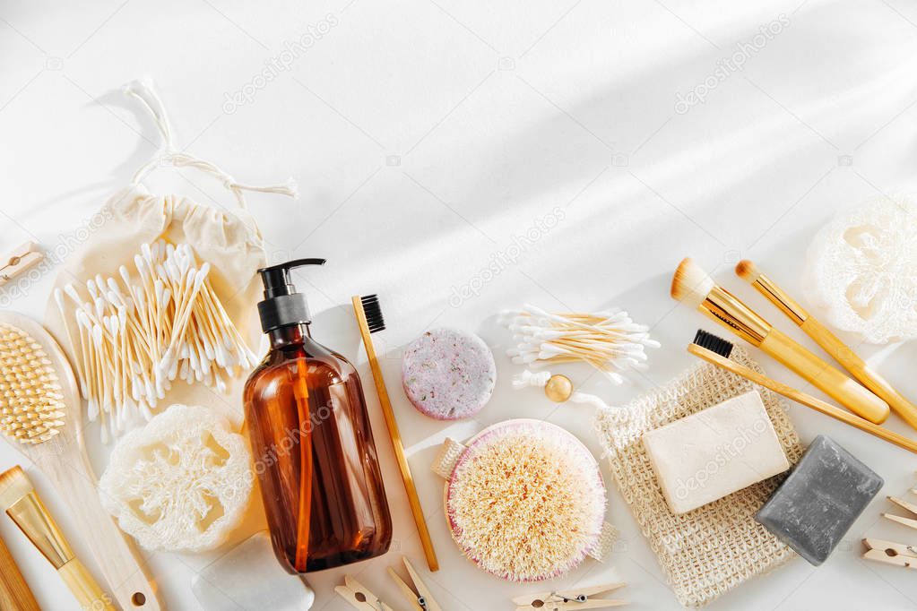 Set of Eco cosmetics products and tools. Soap, Shampoo Bottles, bamboo toothbrush, natural wooden brush. Zero waste, Plastic free. Sustainable lifestyle concept. 