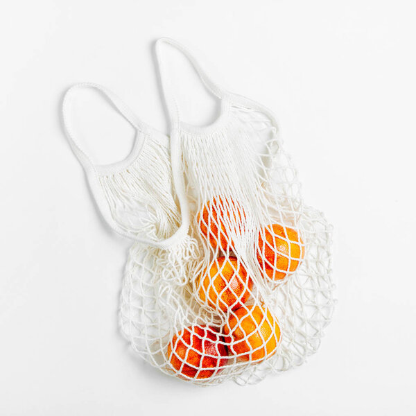 Cotton net bag with fruits. Sustainable lifestyle.  Eco friendly concept.
