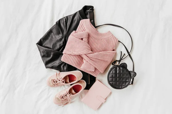 Leather Jacket Pale Pink Warm Sweater Sneakers Handbag White Sheet — Stock Photo, Image