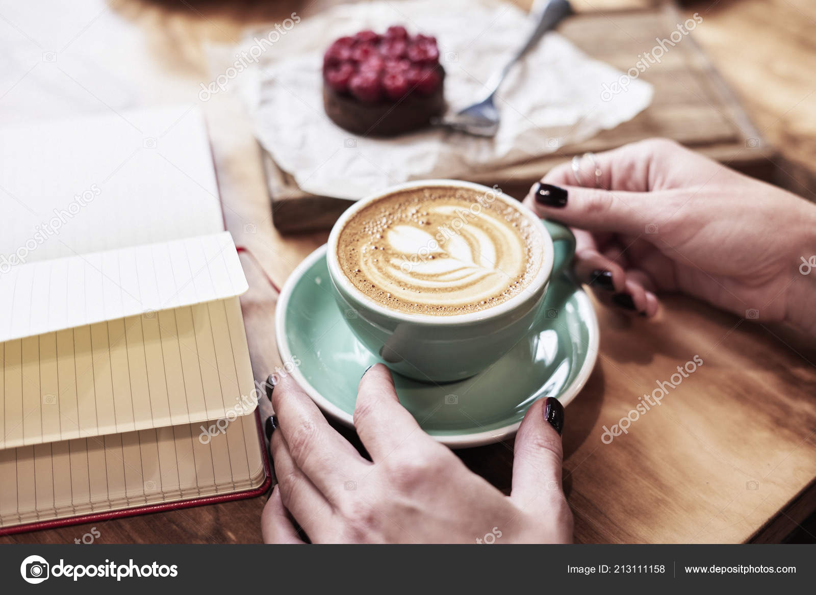 Cup Of Coffee Latte On Wooden Table Or Background In Woman Hands From Above Having Lunch In Cafe Opened Notebook Space For Design Template Stock Photo C Pogorelova 213111158