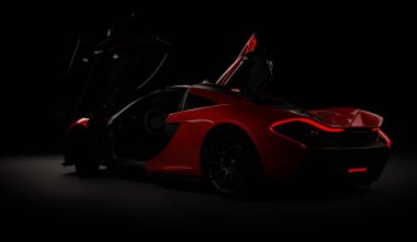 Almaty, Kazakistan - 22 Ekim 2019: koyu arka planda Mclaren P1 stil lüks süper araba. 3d hazırlayıcı