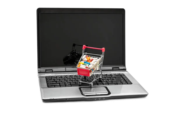 Full Kundvagn Med Piller Laptop Isolerad Vitt — Stockfoto