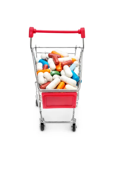 白い背景に丸薬の完全なショッピングカート — ストック写真
