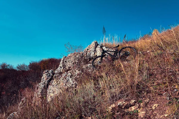 Outdoor cycling. Mountain bike in wild nature landscape background. Landscape of central Russia countryside with hill.