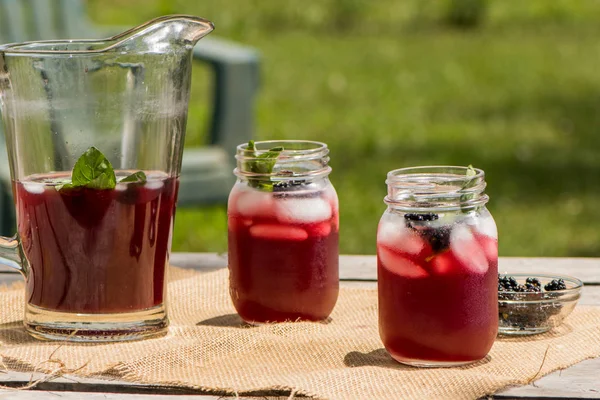 Cannine Jars Blackberry Tea Outdoors Picnic Table — Stock Photo, Image