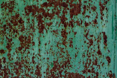 Soyulması yeşil boya ile bir eski paslı metal duvar dokusu