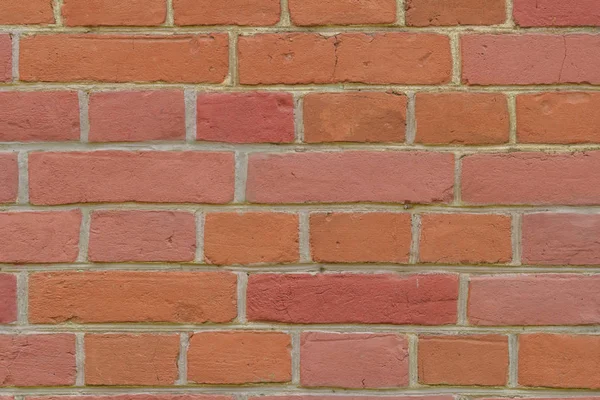 Textura de um fundo de parede de tijolo vermelho — Fotografia de Stock