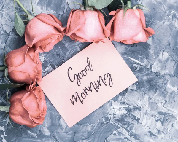 Romantic good morning concept. Red roses and lettering wishing