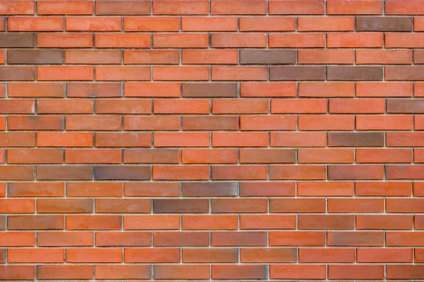 Textura de un fondo de pared de ladrillo rojo y marrón —  Fotos de Stock