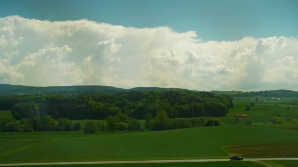 Train traveling near the picturesque fields — Stock Video