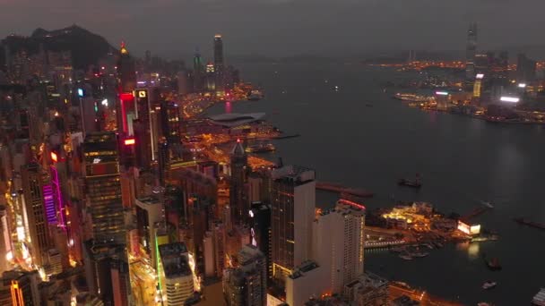 Night Time Illuminated Hong Kong Cityscape Downtown Victoria Harbour Aerial — Stock Video