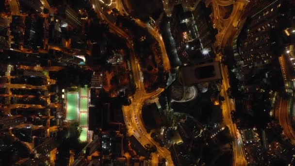 Night Time Illuminated Hong Kong City Traffic Streets Aerial Topdown — Stock Video
