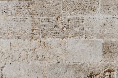 İspanya eski kumlu çizilmiş tuğla duvar. Beton tuğla dokusu